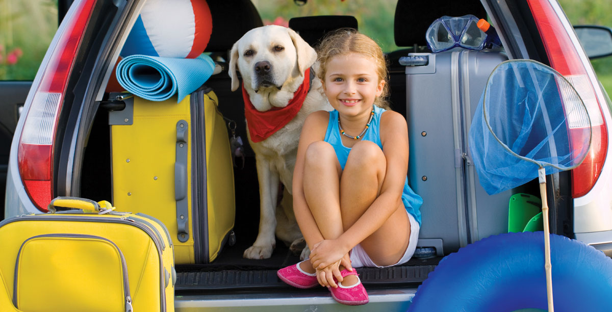 Vacation, Travel - girl with dog ready for the travel for summer vacation